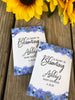 purple or blue daisy baby shower seed packets favors